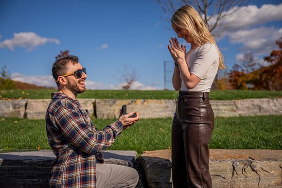 Alumni couple getting engaged on campus