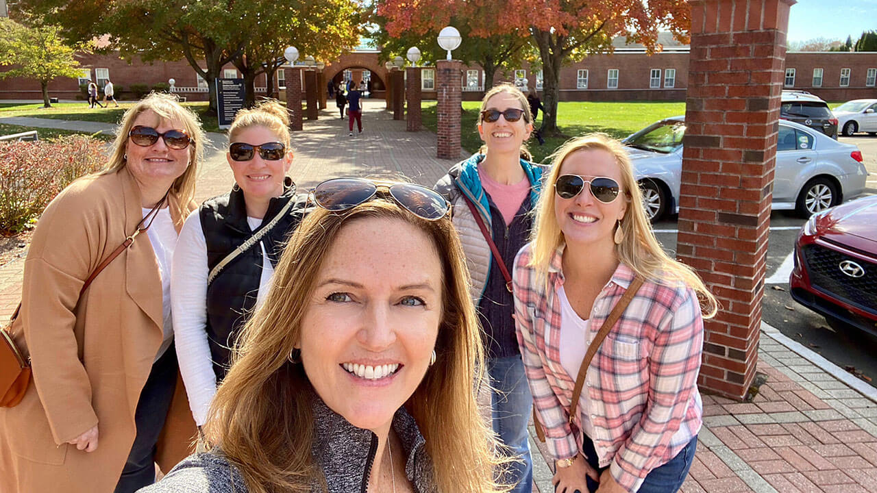 Group of friends posing for a picture near The Dome during Bobcat Weekend