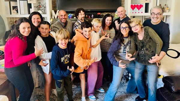 Quinnipiac alumna Erin Moody poses for a picture with family and friends from Quinnipiac