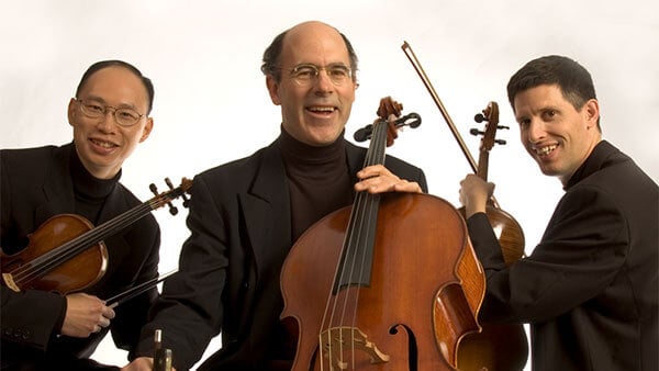 Image of the Adaskin String Trio with their instruments