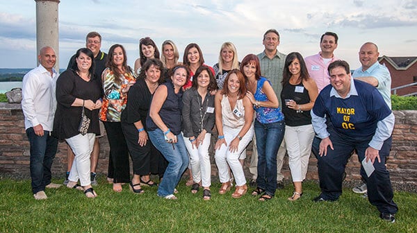 Members of the Class of 1990 celebrating their reunion on the Quinnipiac York Hill campus.