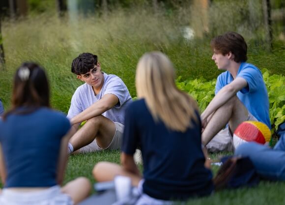 Students talk at Orientation on the Quad