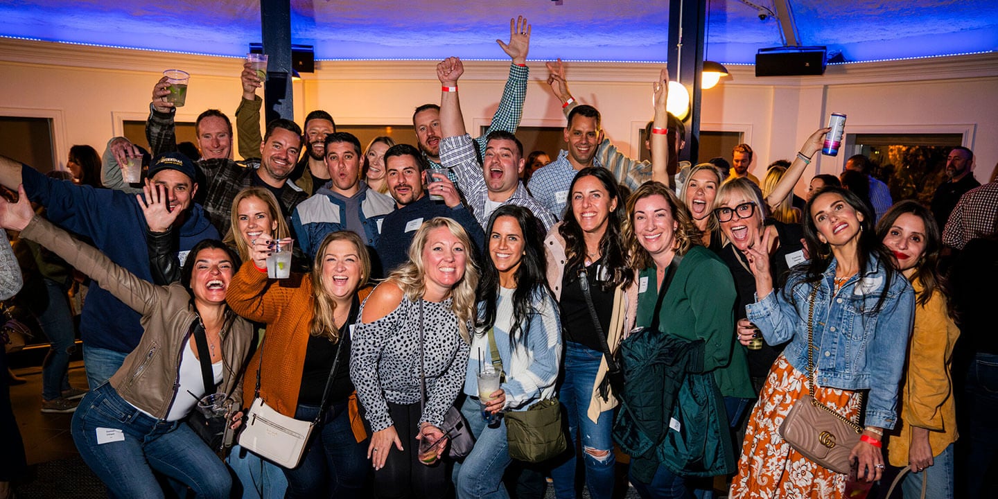 Alumni posing for a photo during a reunion event at Bobcat Weekend