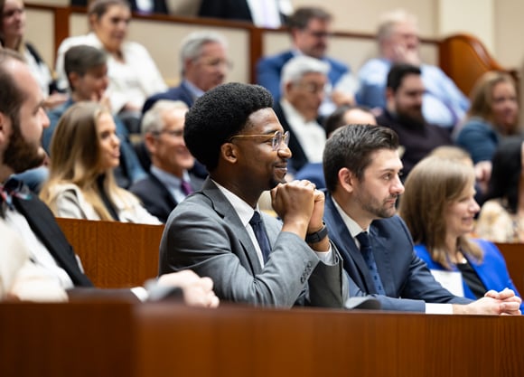 Dozens of Quinnipiac Law alumni sit in the Ceremonial Courtroom during an alumni awards ceremony