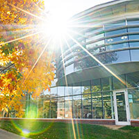 Image of the back of the library with sun shining bright