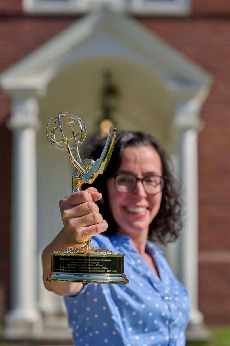 Angelina (Reyes) Vaughn holds up her Emmy award trophy